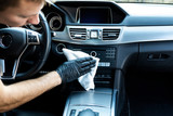 Fototapeta Kwiaty - Cleaning the car, cleaning the interior of the car with a microfiber cloth