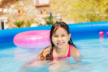 Wall Mural - Portrait of a girl in swimming pool