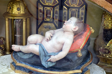 Wall Mural - Baby Jesus figure in San Petronio Basilica in Bologna, Italy