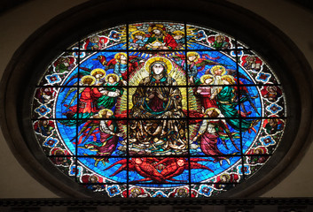 Virgin Mary surrounded by Angels by Lorenzo Ghiberti, 1405, stained glass window in the Cattedrale di Santa Maria del Fiore (Cathedral of Saint Mary of the Flower), Florence, Italy