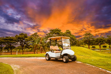 A Golf Cart Parking On Road At Golf Course With Beautiful Twilight Sky Background, Summer Color Style.