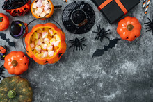 Table Top View Aerial Image Of Decoration Happy Halloween Day Background Concept.Flat Lay Accessories Essential Object To Party The Pumpkin & Sweet Candy On Rustic Stone.Space For Creative Design.
