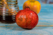 On the table in the synagogue are the symbols of Rosh Hashanah apple and pomegranate