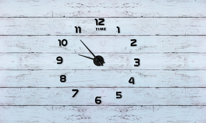 Clock on wooden background