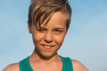 Closeup portrait of a boy in beauty summer day.