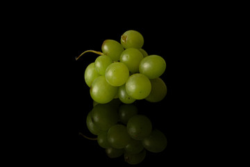 Wall Mural - Lot of whole fresh green grape pile isolated on black glass