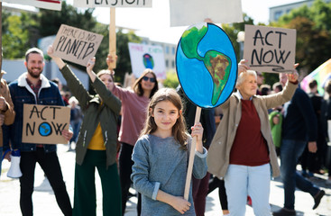 people with placards and posters on global strike for climate change.