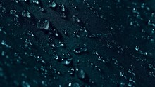 Super Slow Motion Of Falling Water Drops On Waterproof Cloth Texture In Detail. Filmed On High Speed Cinema Camera, 1000 Fps.