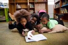 School Kids Reading In The Classroom