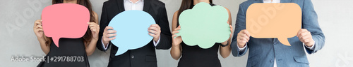 Fotomural People are holding colorful Speech Bubbles.