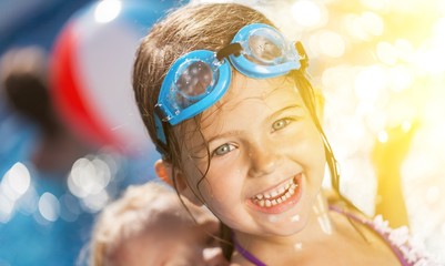 Poster - Beautiful little girl sunning at the pool