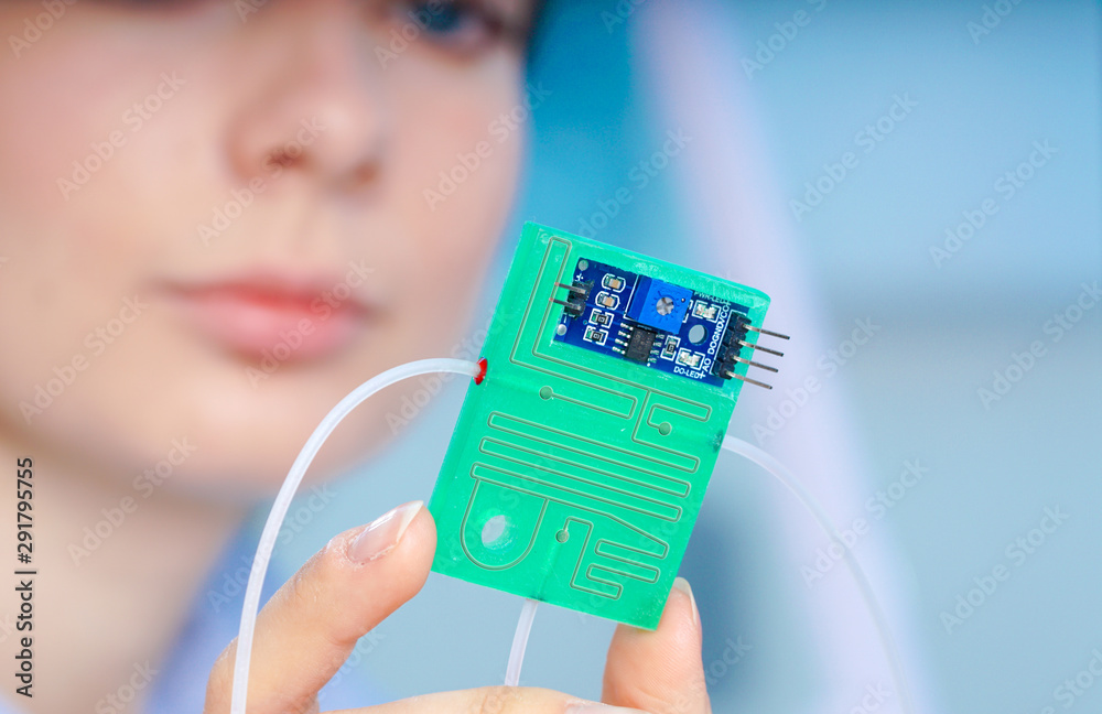 Girl holding polymers Bio-MEMS biomedical microelectromechanical ...