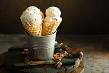 Homemade Caramel Pecan Ice Cream Cones On Dark Background