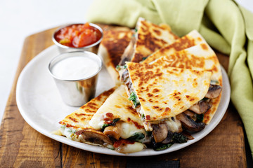 Wall Mural - Mushroom and cheese quesadillas with sour cream and tomato salsa