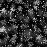 Fototapeta  - Christmas seamless pattern of snowflakes of different shapes, sizes and transparency in gray and black colors