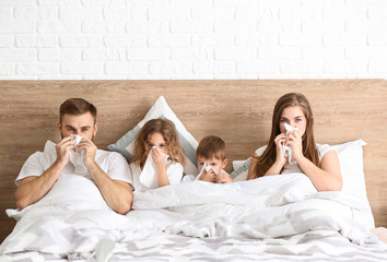 Sticker - Family ill with flu in bed at home