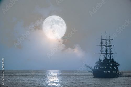 old pirate ship sailing, night at sea