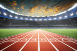 Athlete running track with number on the start in a stadium . Evening scene .