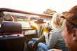 © Trinette Reed/Stocksy - Woman dancing to music in front seat