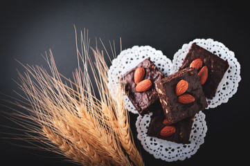 Wall Mural - homemade chocolate brownies on dark background