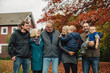 © Rob and Julia Campbell/Stocksy - Multi-generational group portrait outside