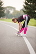 © Olga Mishyna - sport girl making exercises outdoors. Young sport woman in a park. Sport and fitness on open air