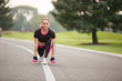 © Olga Mishyna - sport girl making exercises outdoors. Young sport woman in a park