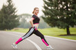 © Olga Mishyna - sport girl making exercises outdoors. Young sport woman in a park. Sport and fitness on open air