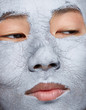 © leandro crespi/Stocksy - Closeup photo woman with clay mask