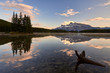 © INIGO CIA DA RIVA/Stocksy - Rundle Mountain reflecting in Two Jack Lake in Banff National Park at sunset