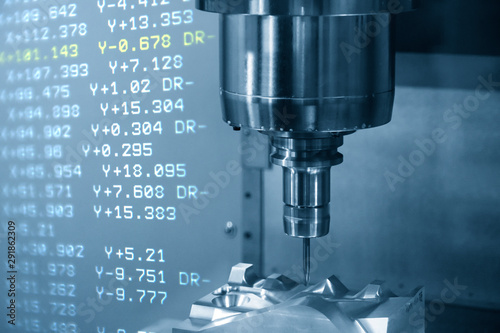 Fotomural The abstract scene of the G-code data background and the CNC milling machine cutting the mould and die parts with solid ball endmill tools