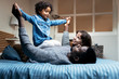 © Santi Nunez/Stocksy - Happy family having fun at home
