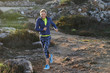 © Ivan Gener/Stocksy - Senior woman trail running.