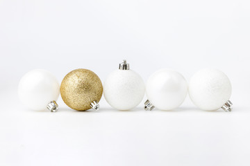 five colored christmas balls on white background. christmas decor and toys.