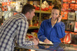 © auremar - woman helping customer household store