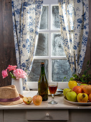 Wall Mural - Bottle and glass of cider with apples. In rustic house