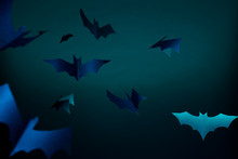 Halloween Photo Of Blue Paper Bats On Dark Blue Background.