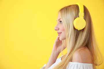 Sticker - Beautiful young woman listening to music on color background