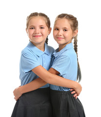 Wall Mural - Portrait of cute twin girls on white background