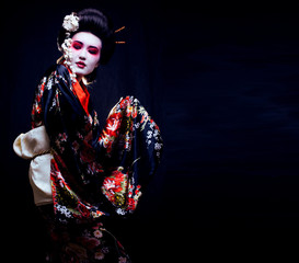 Wall Mural - geisha in kimono on black