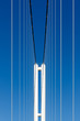 © danielskyphoto - Suspension bridge on blue sky background