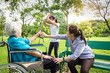 © Satjawat - Asian teenager girl hands up to prevent grandmother’s hit,elderly grandma holding walking stick in hand,angry senior is hit the naughty granddaughter,bad child behaviour in park,family