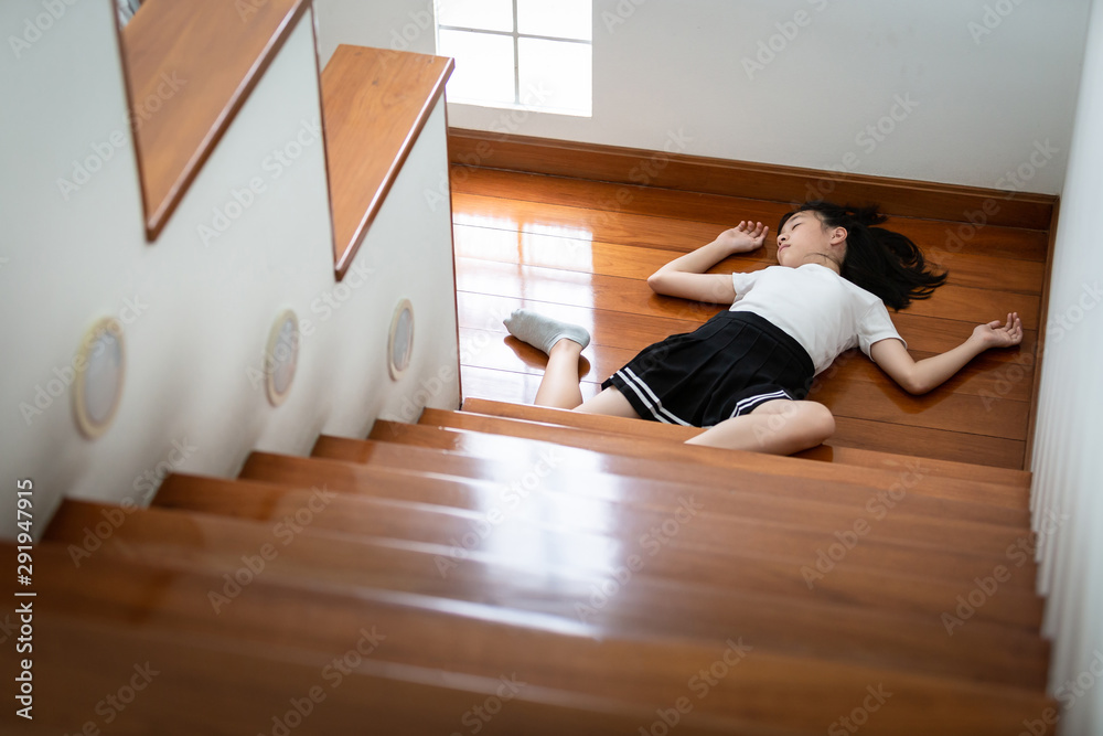 Asian child girl in coma on floor feeling unconscious after accident ...
