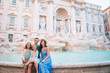© travnikovstudio - Happy family near Fontana di Trevi with city map