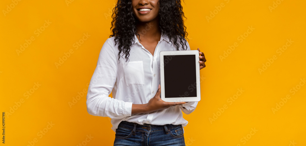 African woman showing blank digital tablet screen Stock Photo | Adobe Stock