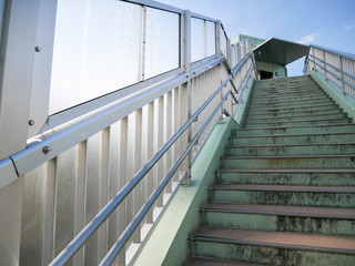 Wall Mural - landscape view of the stair up to overpass in tyokyo city without any pedestrian in summer sunshine 