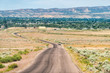 © Kristina Blokhin - Jensen or Vernal Utah road highway with view of city near Dinosaur National Monument desert landscape