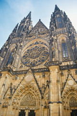 Wall Mural - View from below on ancient the St. Vitus Cathedral with a round ornament in center in Prague