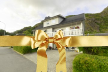 Wall Mural - Golden ribbon wrapped in a bow