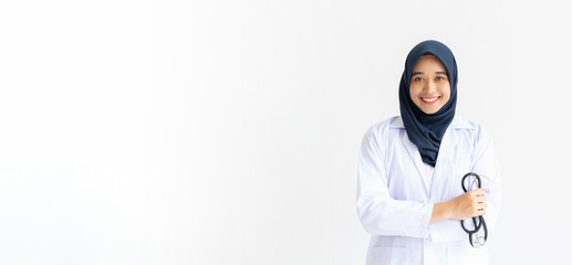 Wall Mural - Young Arab Muslim intern doctor women smile on isolate white background concept for Islam people working in medical hospital health care, Modern Nurse wearing hijab in medico clinic business service.